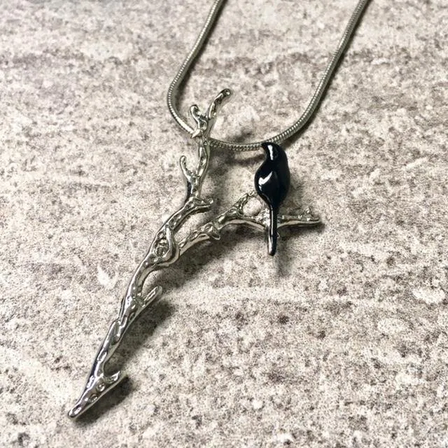 BLACK BIRD-ON-A-BRANCH PENDANT NECKLACE WITH SILVER CHAIN